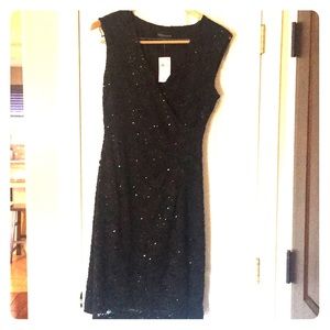 Black sequined cross front dress with rushing.